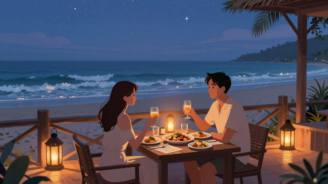 A couple dining under lanterns on a quiet beach terrace at dusk.